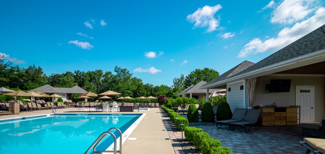 A view of the resort style pool and cabanas at West Hills Country Club