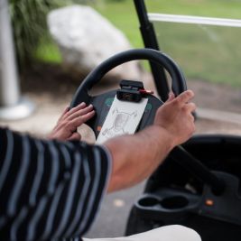 driving-golf-cart A golfer driving a golf cart