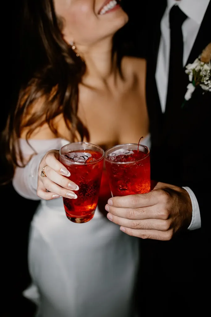 Hudson Valley Wedding Venue Couple holding their signature drink at a West Hills Country Club Wedding