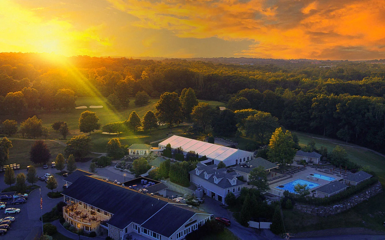 Aerial View of West Hills Country Club Golf Course and Resort Style Pool at Sunset